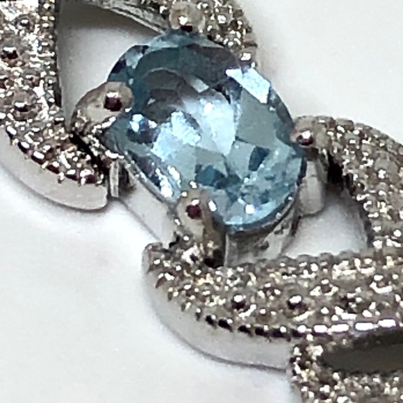 Rhodium Plated Blue Topaz Infinity Bracelet - Picture 2 of 11